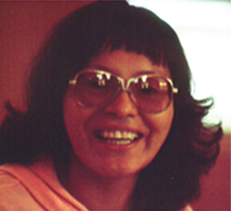 An old photo of a woman smiling