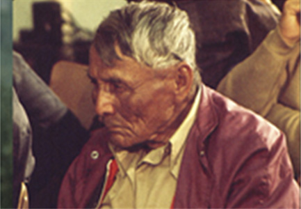 An old man sitting attentively